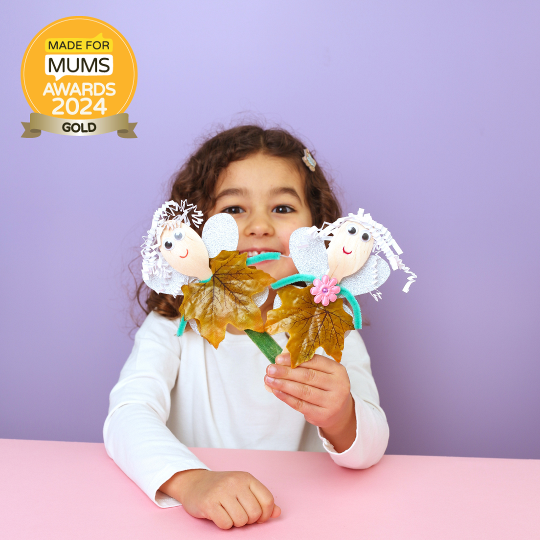 Child holding leaf crafts with a 'Made for Mums Awards 2024 Gold' badge on a purple background