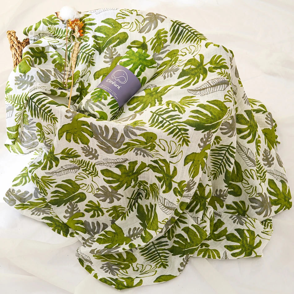 Green leaf-patterned fabric with a woven basket on a white background