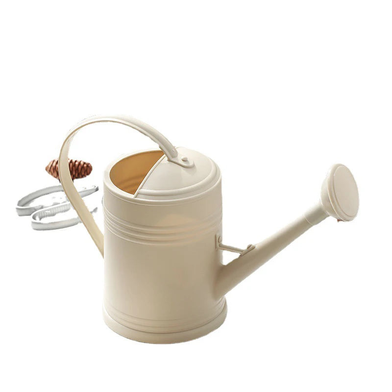 Beige watering can on a white background
