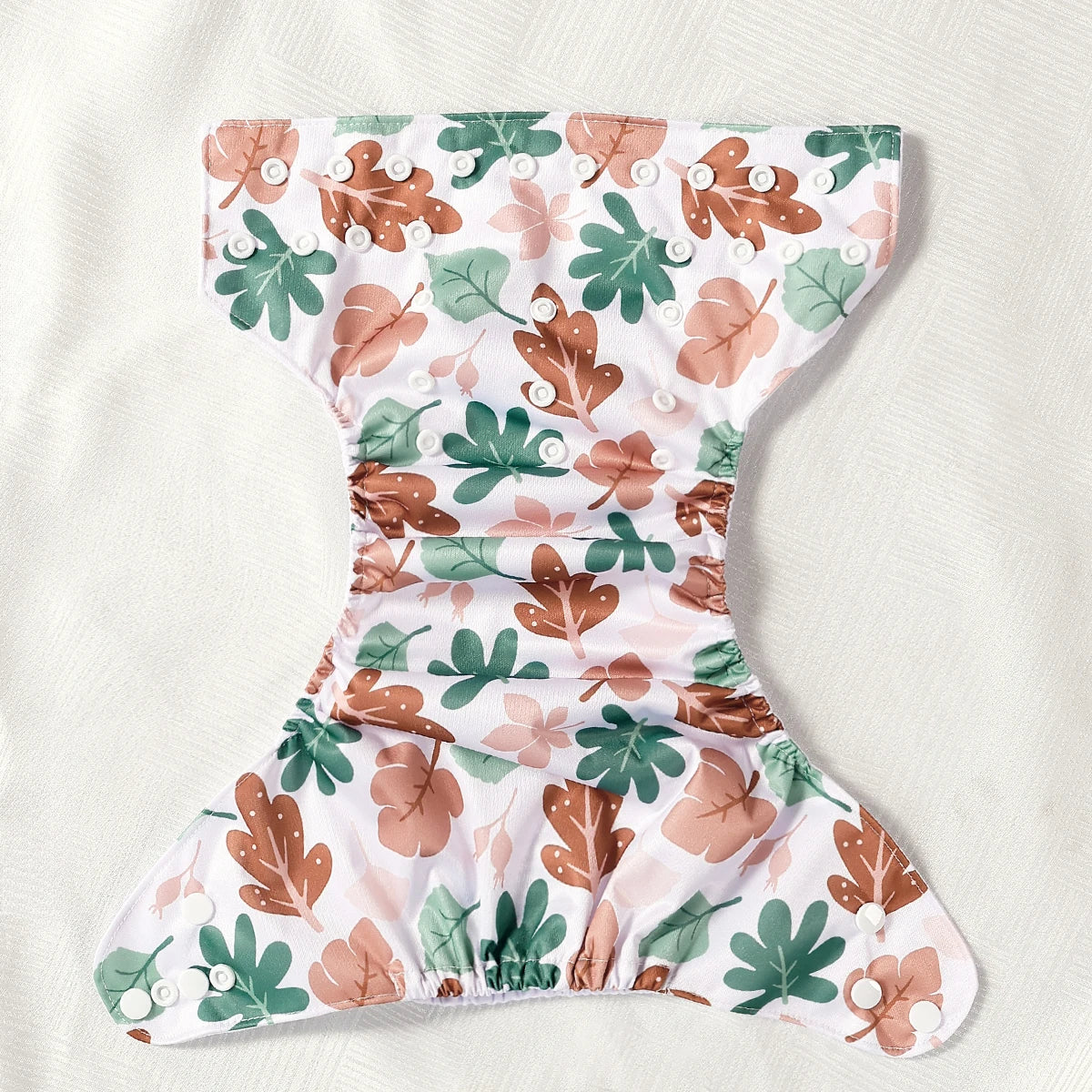 Floral-patterned diaper cover on a white background