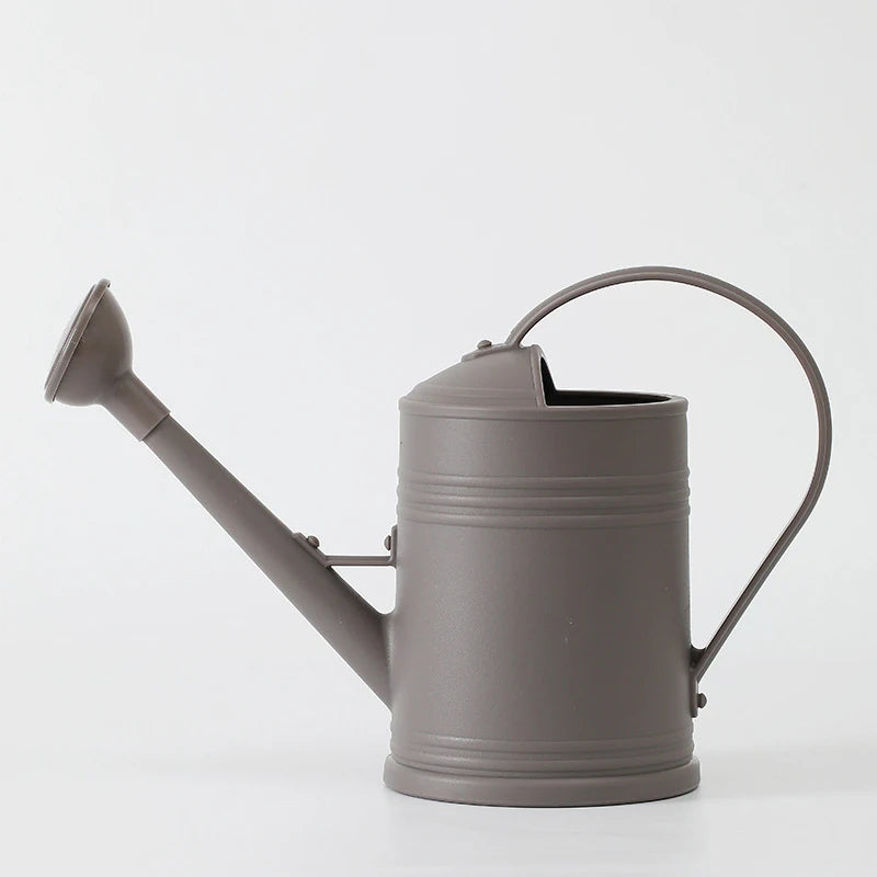 Gray watering can on a white background