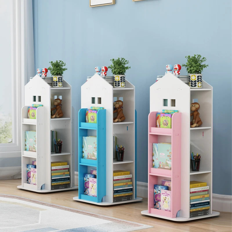 Three colorful children's bookshelves against a blue wall.