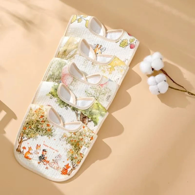 Baby bib with cartoon design on a beige background