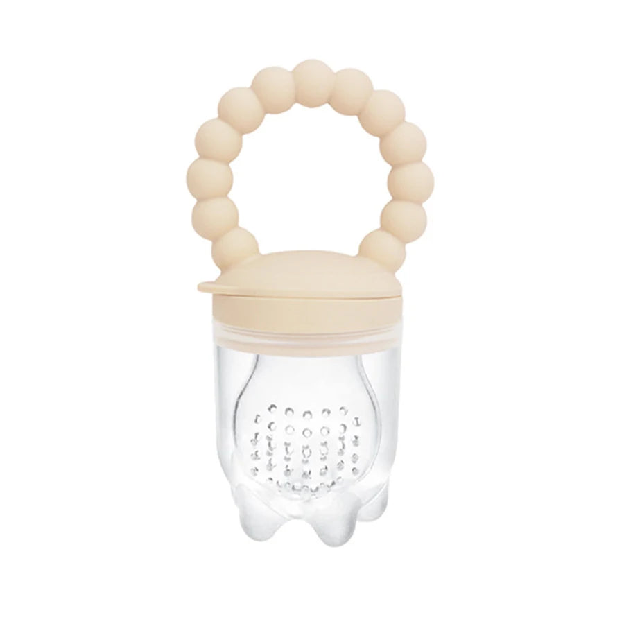Clear fruit pouch with beige lid and teething ring on a white background