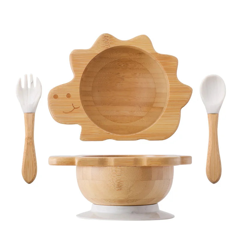 Bamboo baby bowl set with lid, fork, and spoon on a white background