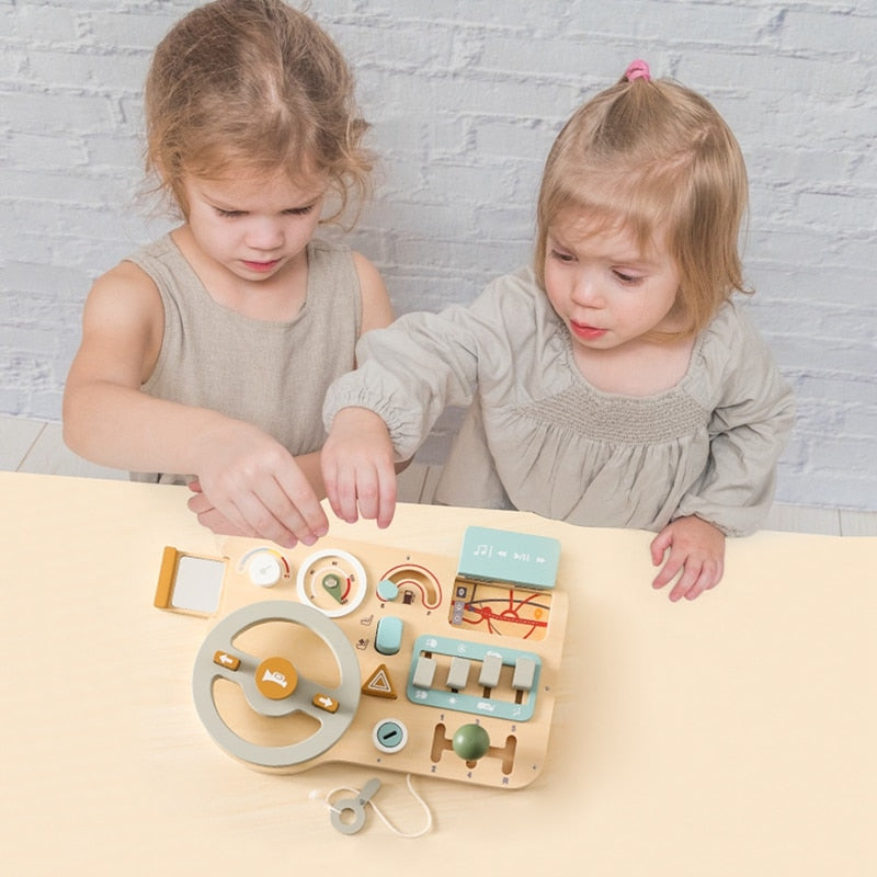 kids playing with montessori toy car busy board