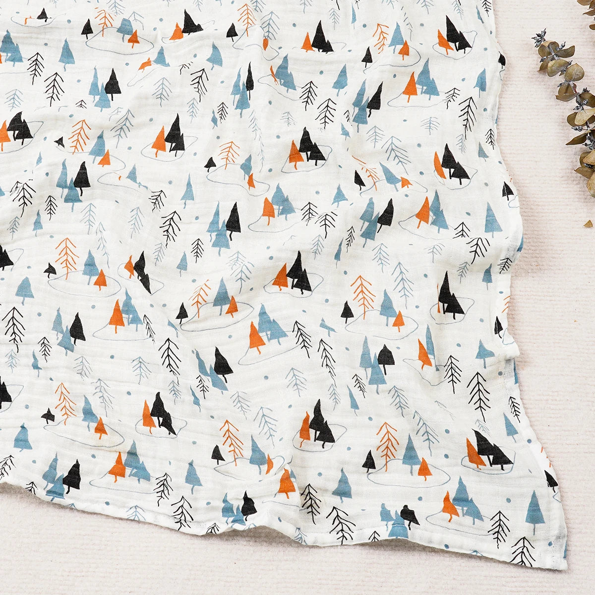 Fabric with a pattern of trees and animals on a white background