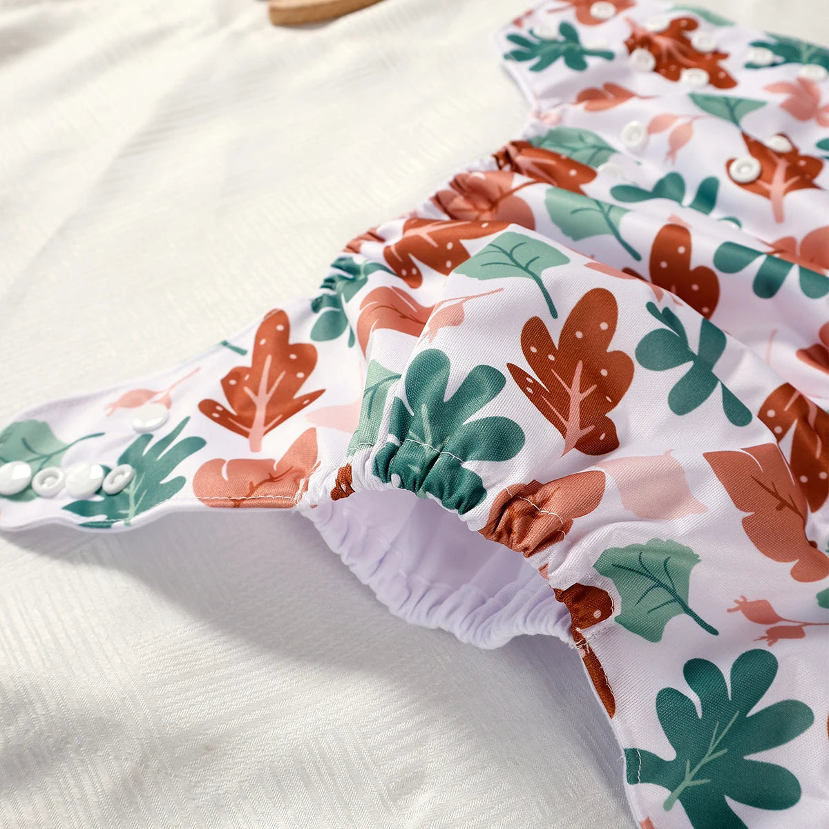Floral-patterned baby bloomers on a white background