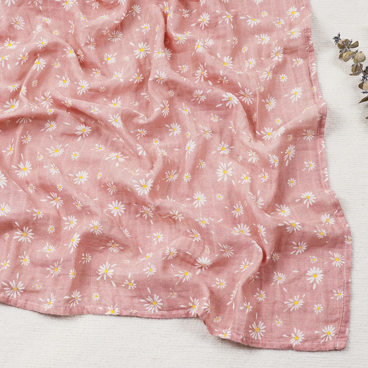 Pink fabric with floral pattern on a white background