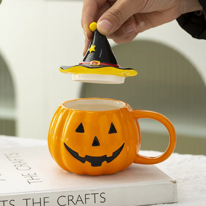 Pumpkin-shaped mug with witch hat lid on a book