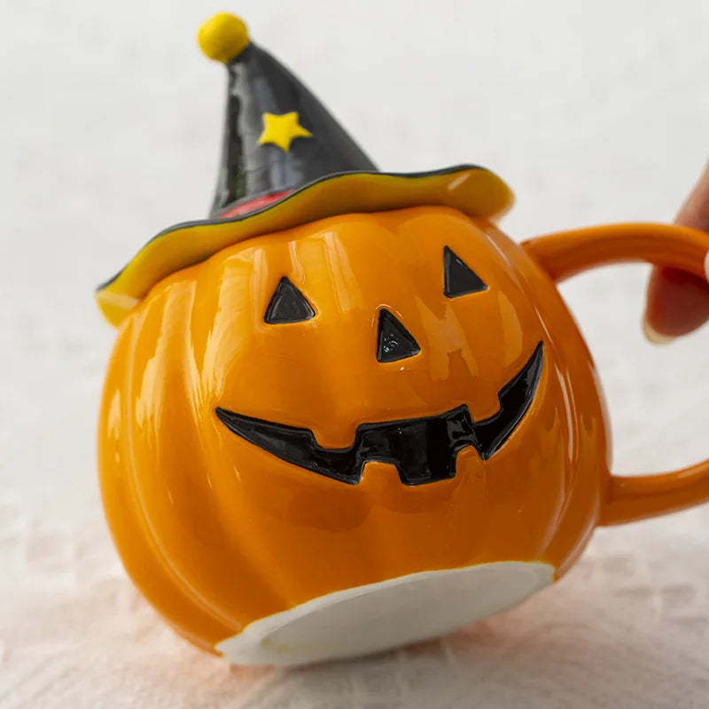 Pumpkin-shaped mug with a witch hat on a light background