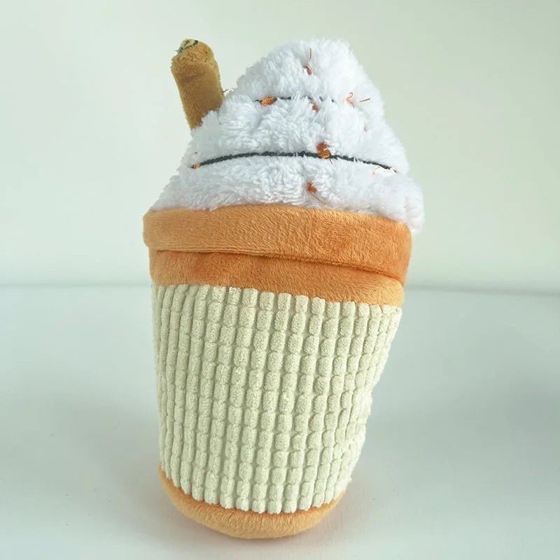 Plush toy resembling a cup with whipped cream on a white background
