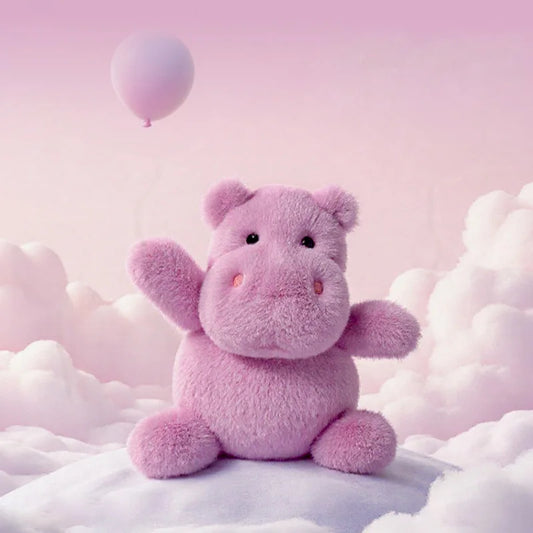 Pink hippo teddy bear sitting on clouds with a pink balloon in the background