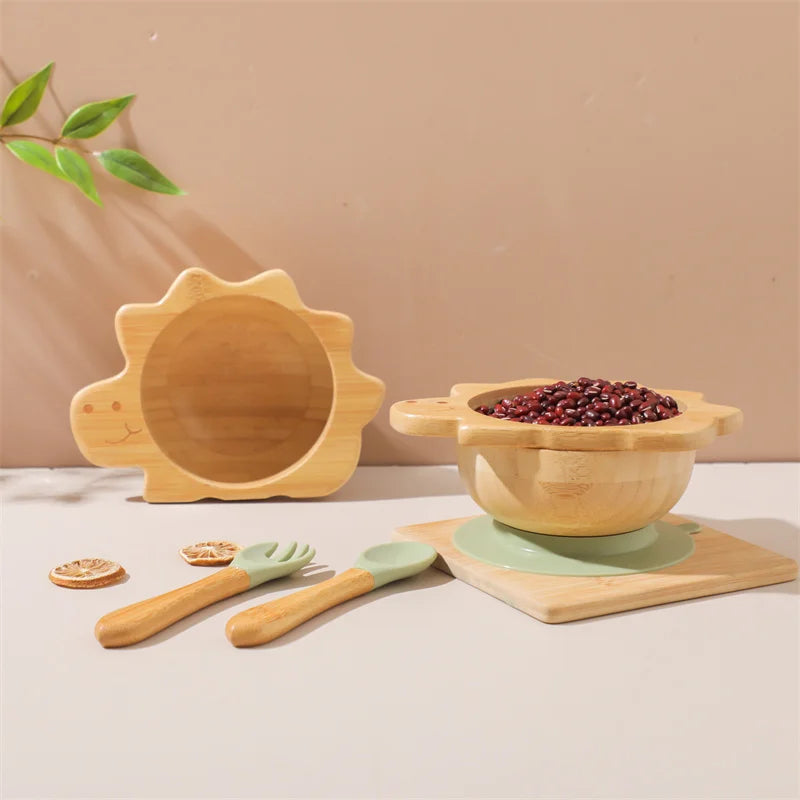 Set of wooden and silicone kitchen utensils on a neutral background