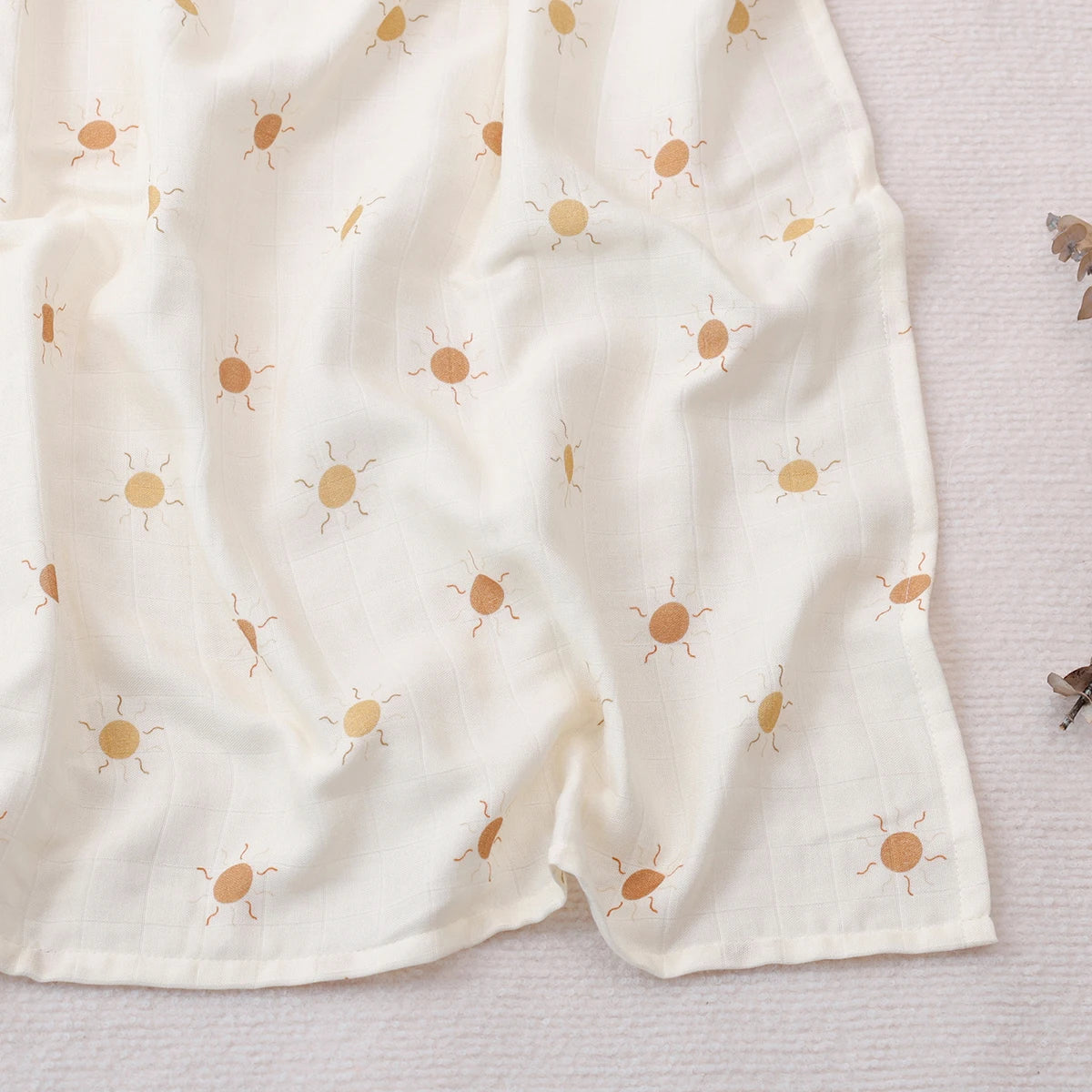 White fabric with small brown bug patterns on a light gray background