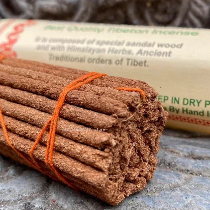 Roll of Tibetan incense sticks with packaging in the background