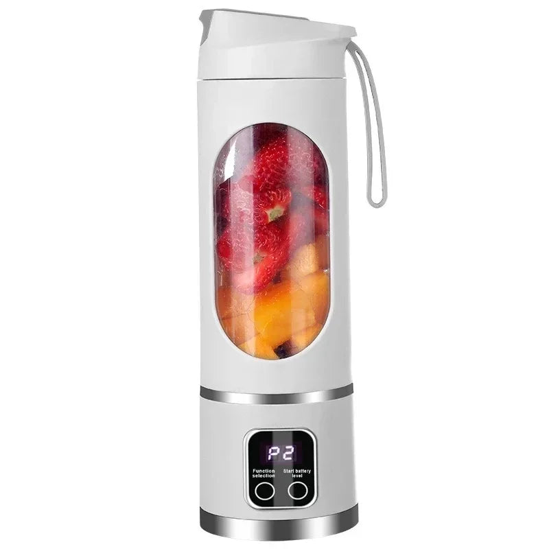 White portable blender with fruits inside on a white background