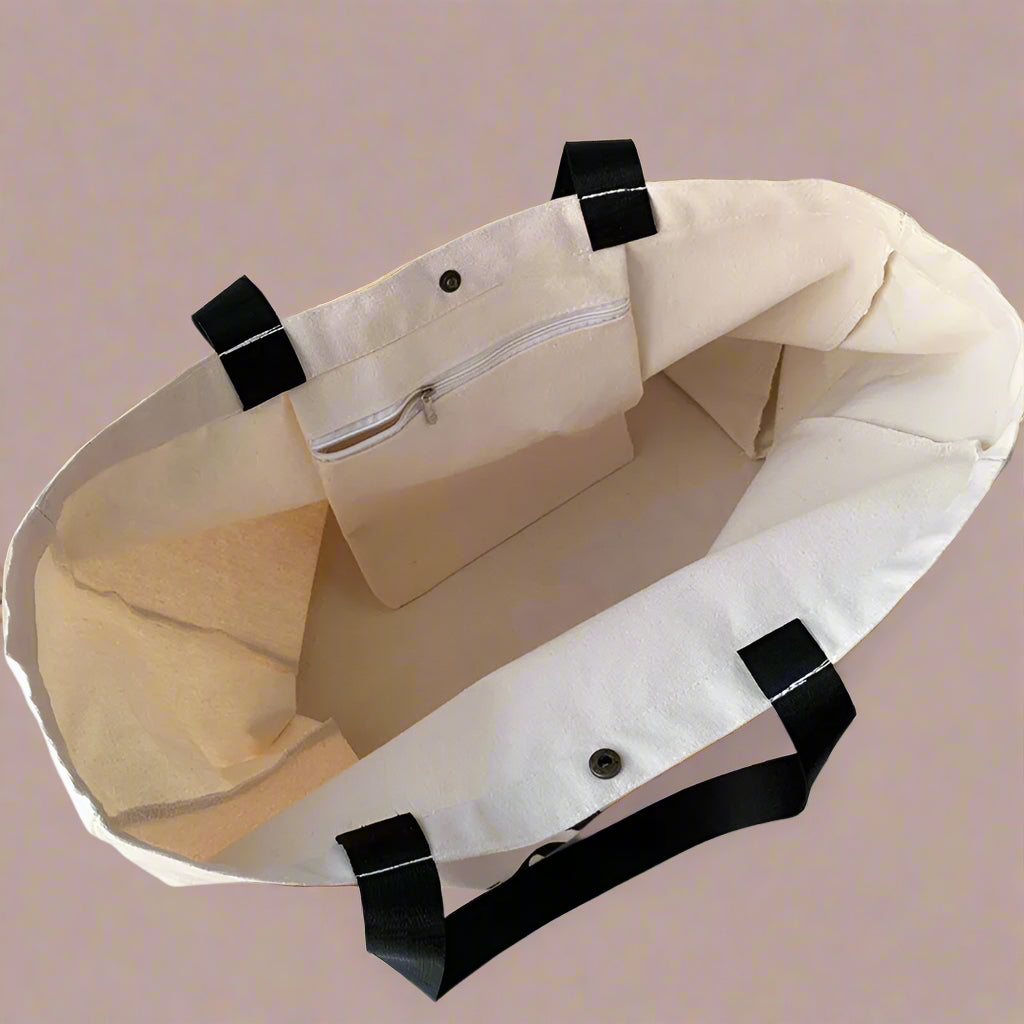 tote bag with black straps on a light surface