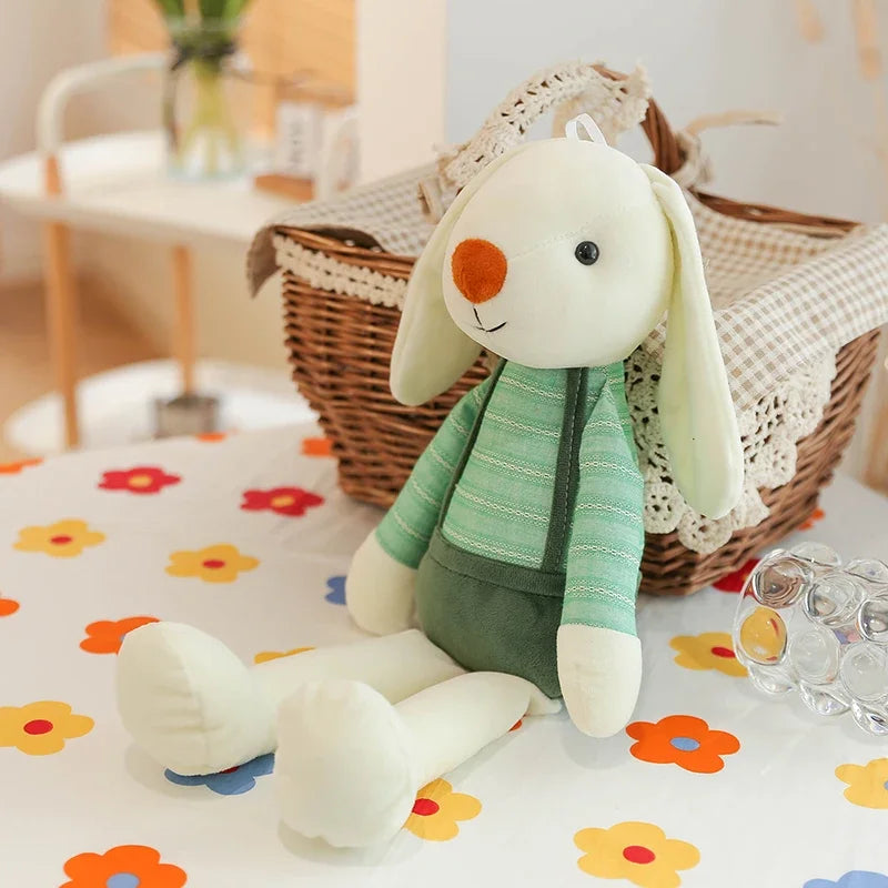Plush toy rabbit in a green outfit on a floral-patterned surface with a wicker basket in the background.