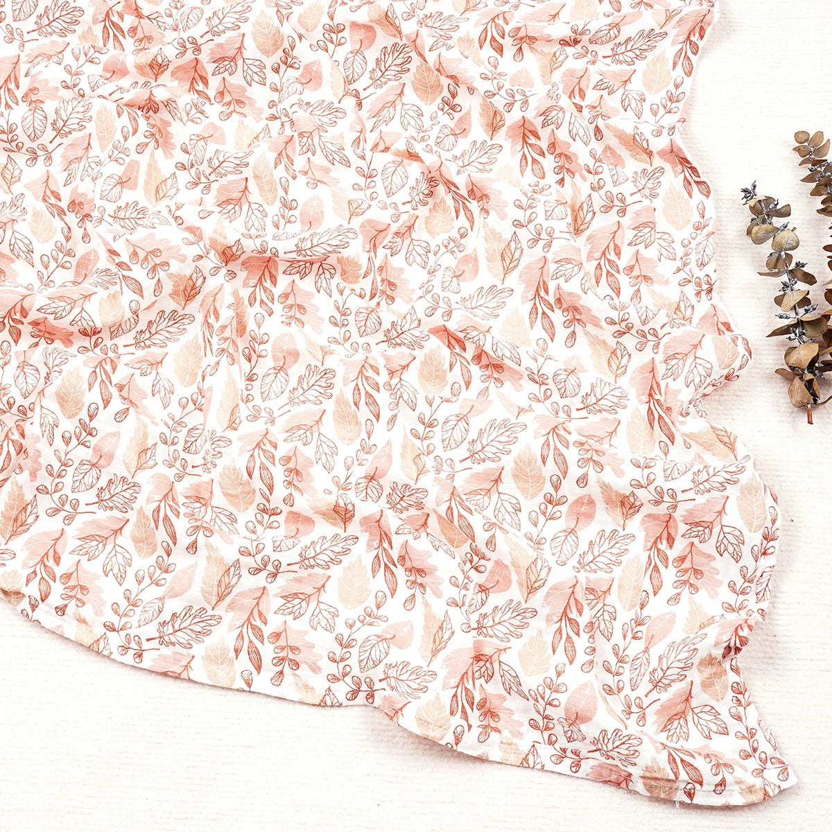 Floral patterned fabric with pink and white flowers on a white background