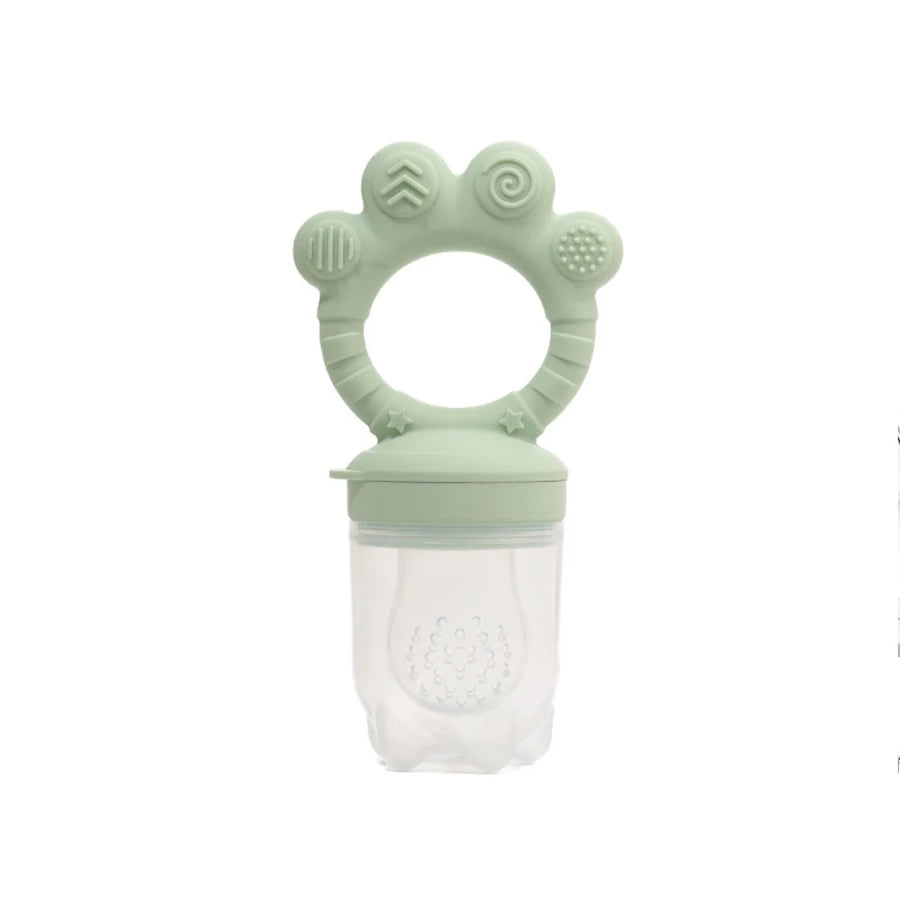 Green silicone baby teether on a white background