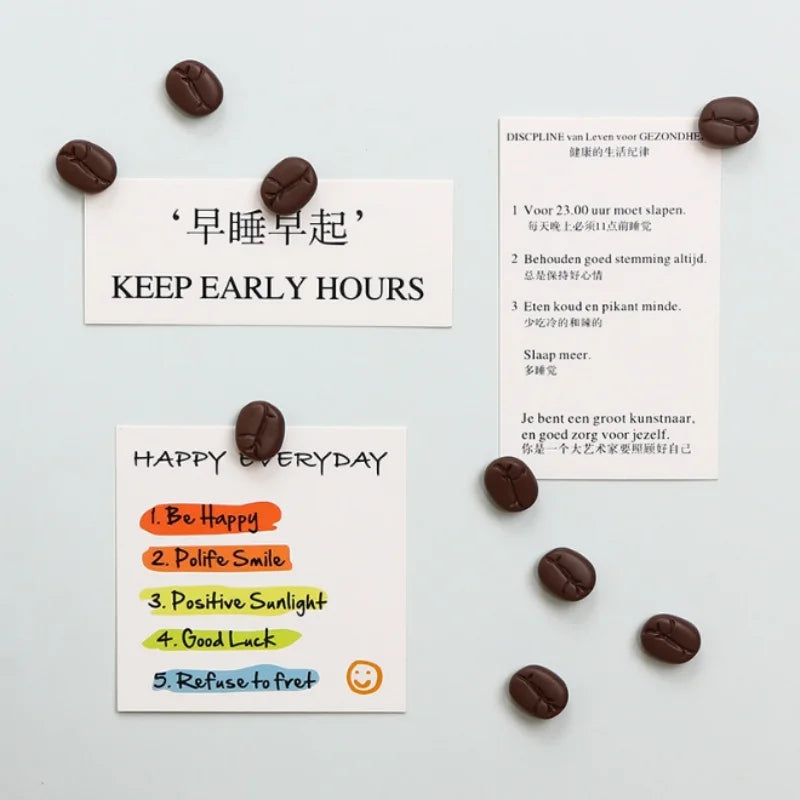Motivational cards with coffee bean magnets on a light gray background
