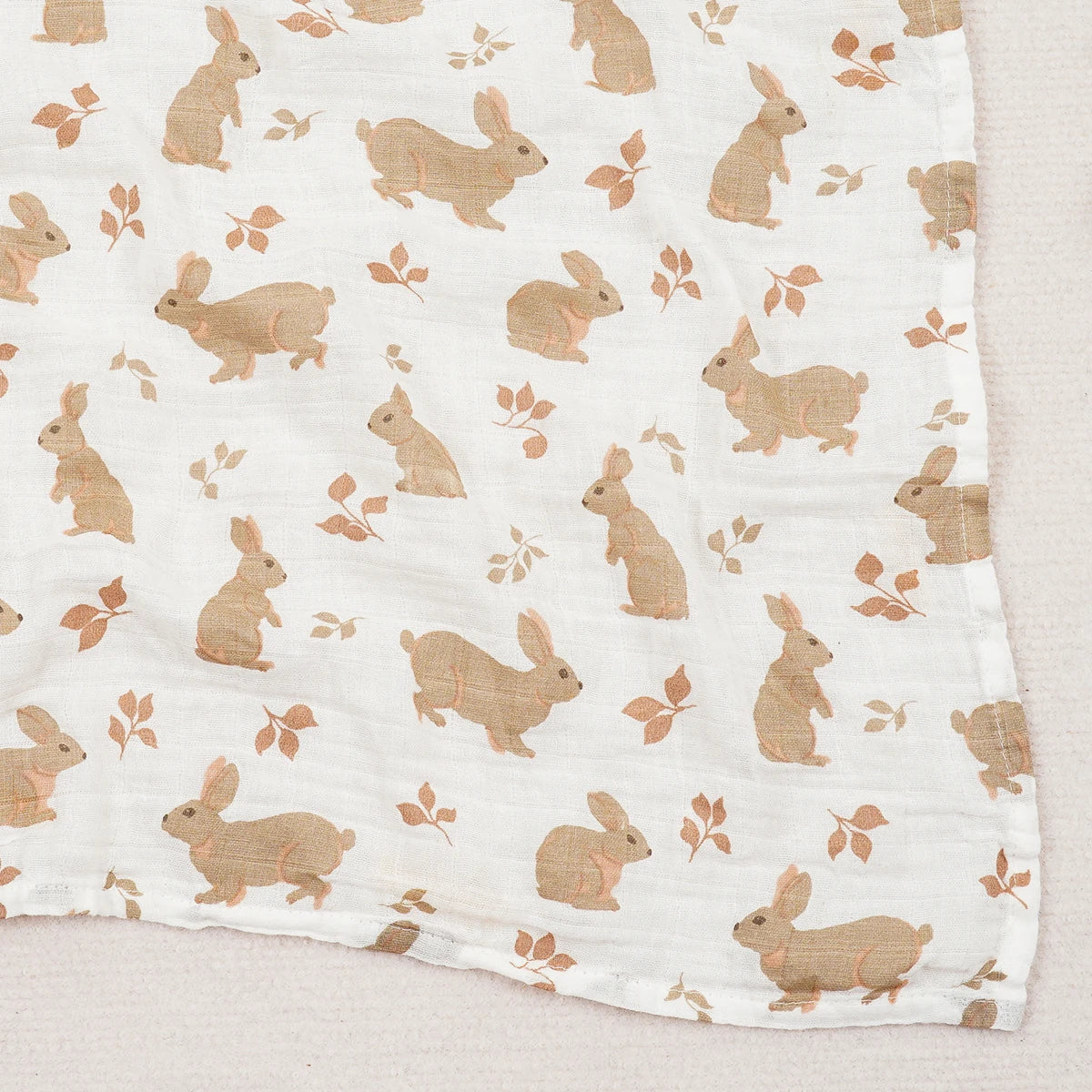 Fabric with brown bunny pattern on a white background
