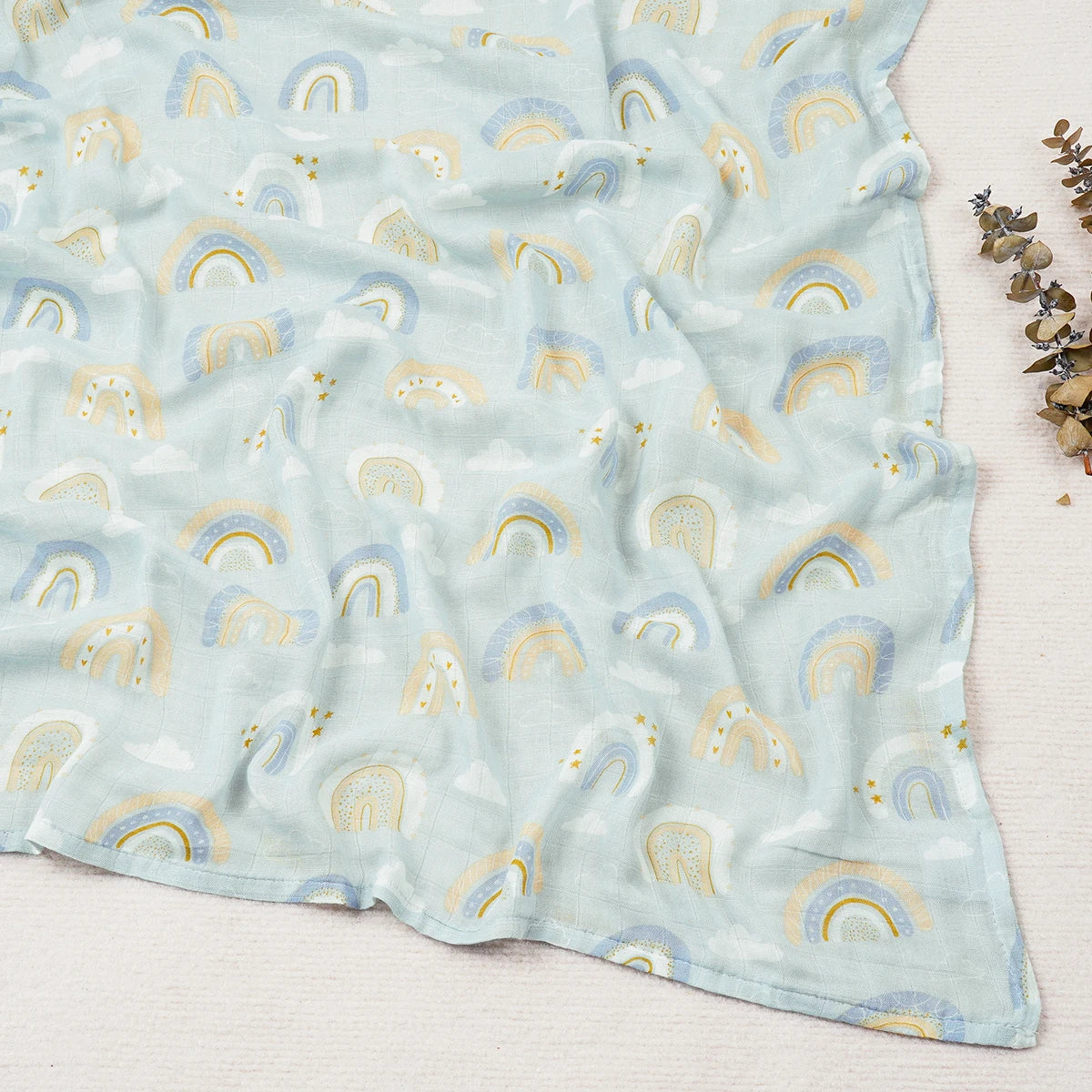 Fabric with rainbow pattern on a light blue background