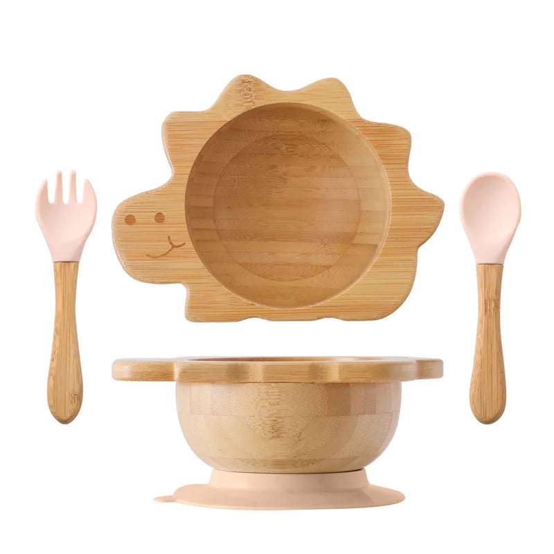 Bamboo children's tableware set with a sun-shaped plate, bowl, fork, and spoon on a white background.