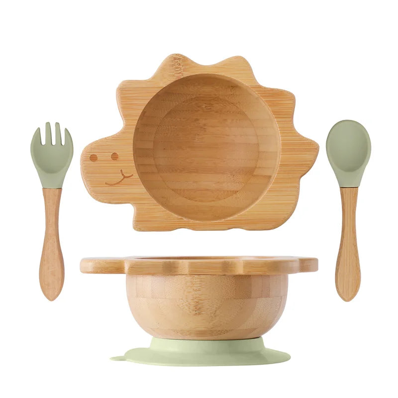Bamboo children's tableware set with bowl, spoon, fork, and lid on a white background