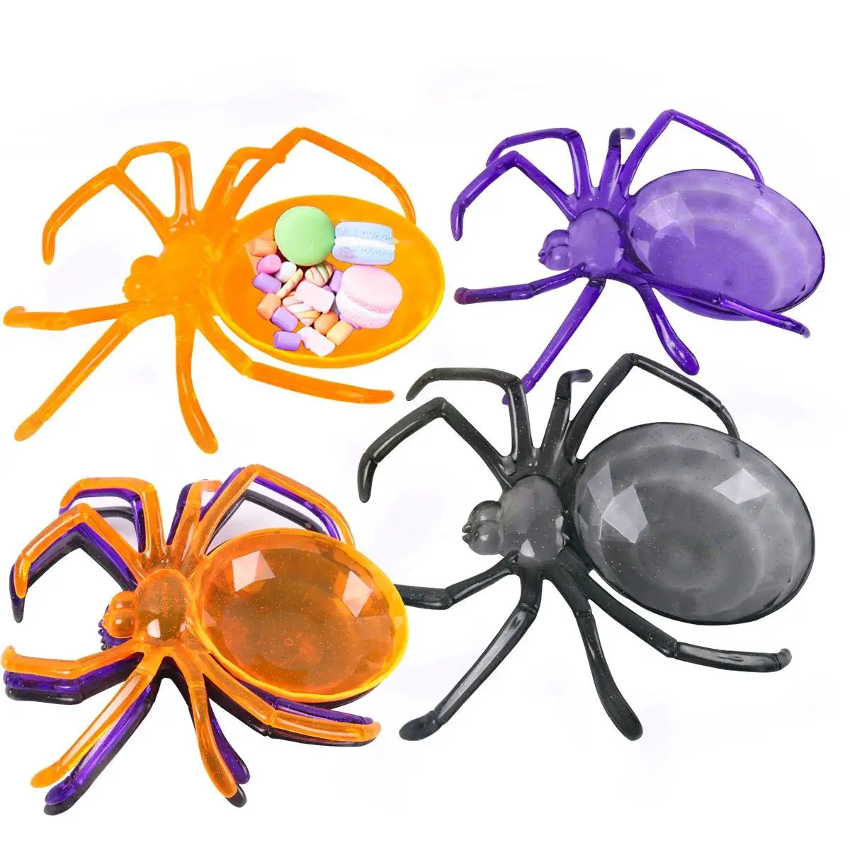 Four spider-shaped candy containers in orange, purple, and black on a white background.
