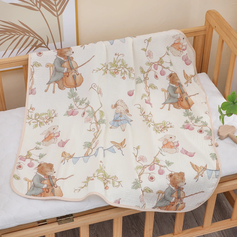 Baby crib with a decorative blanket featuring teddy bears and musical instruments.