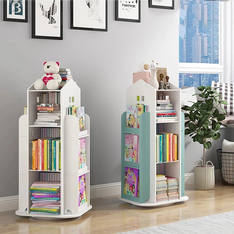 Two children's bookshelves with books and toys in a room with a window and plant.