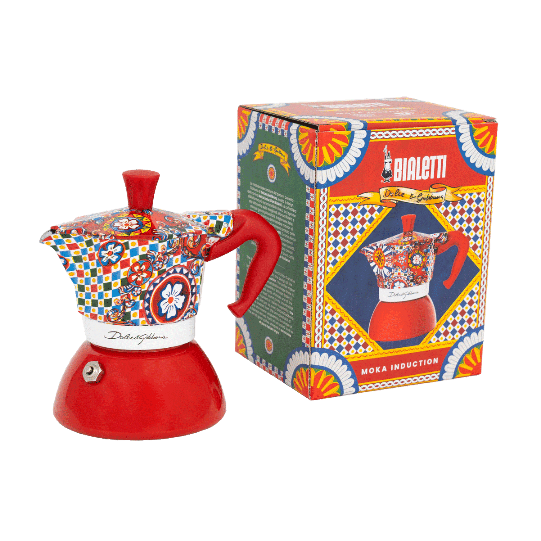 Colorful Moka pot with decorative pattern next to its box on a transparent background