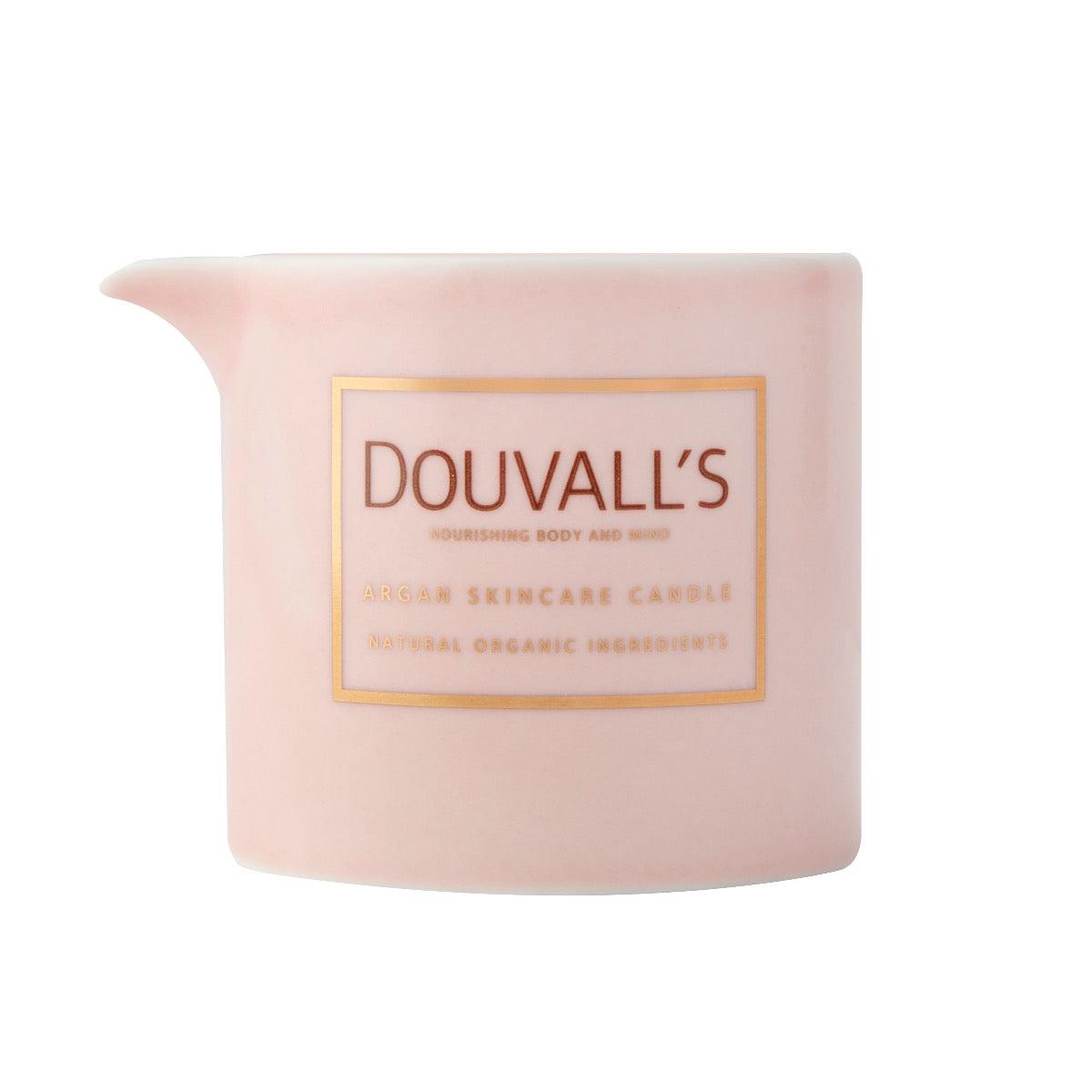 Pink candle with 'Douvall's' branding on a white background