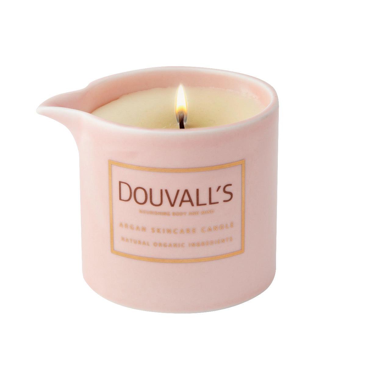 Pink candle with 'Douvall's' label on a white background