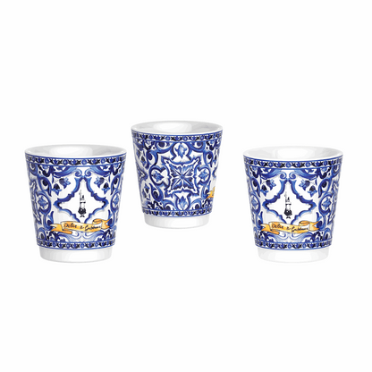 Three ceramic cups with blue and white patterns on a white background