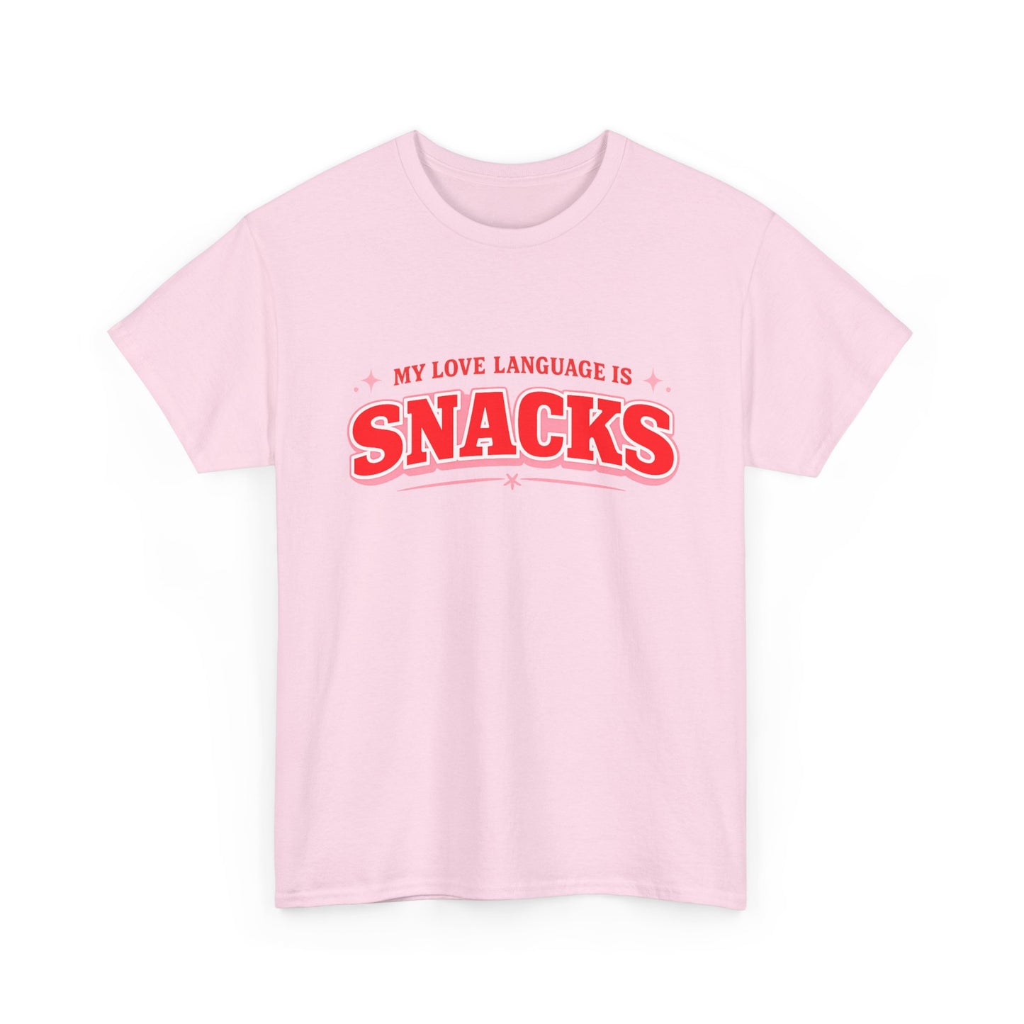 A light pink short-sleeve crewneck t-shirt with a red graphic text print reading 'MY LOVE LANGUAGE IS SNACKS' on the chest, displayed against a solid white background.