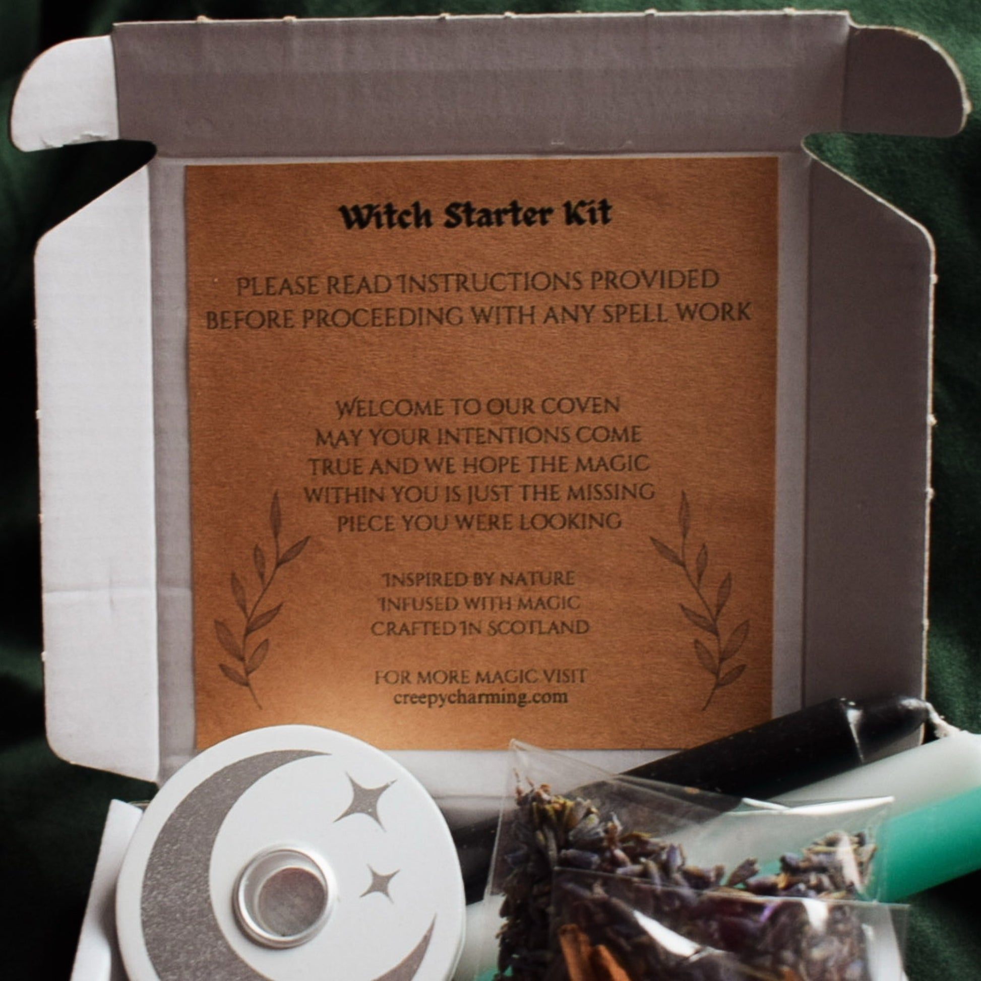 Witch Starter Kit with instructions and items on a dark background