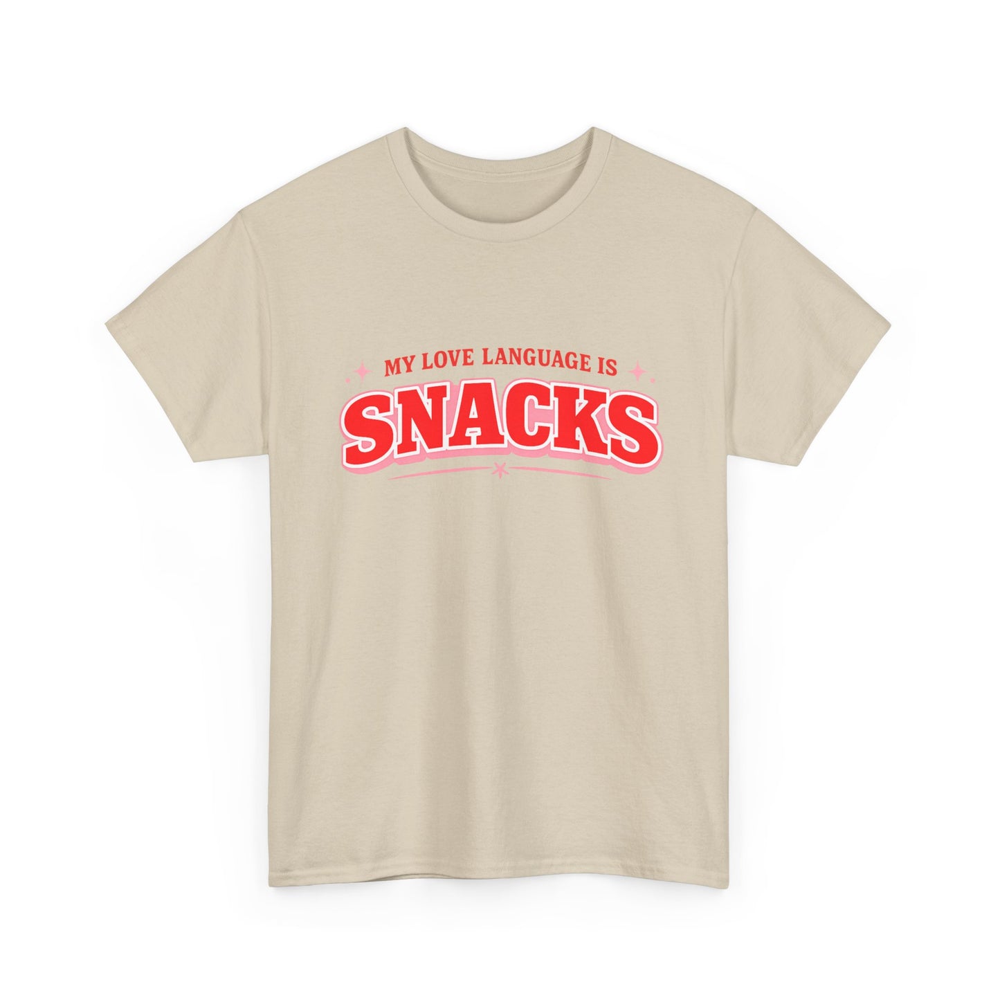 A light beige crewneck t-shirt with a red graphic text print reading 'MY LOVE LANGUAGE IS SNACKS' on the chest, displayed against a solid white background.