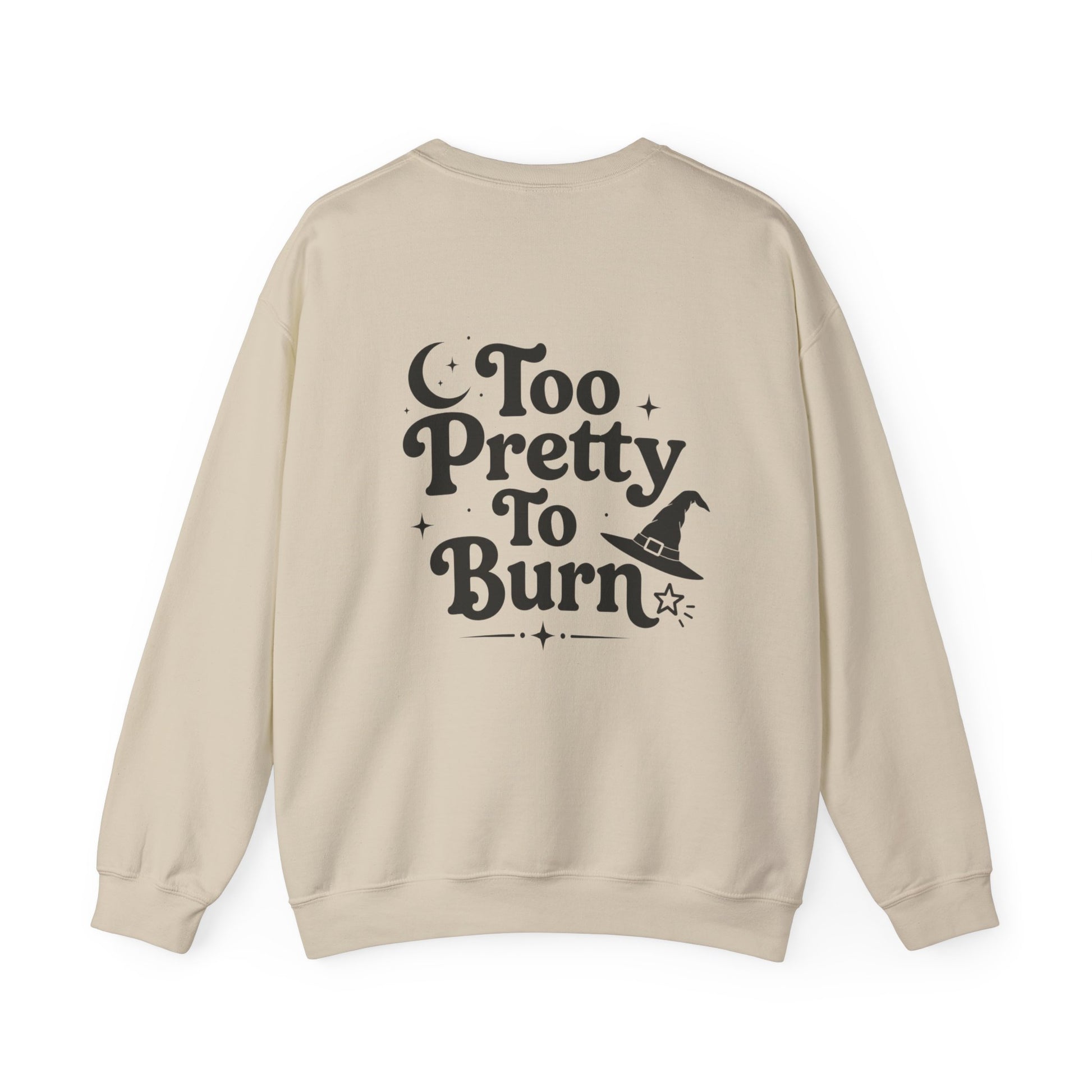 A beige crewneck sweatshirt shown from the back, featuring a black graphic print that reads 'Too Pretty To Burn' alongside a small witch hat illustration.
