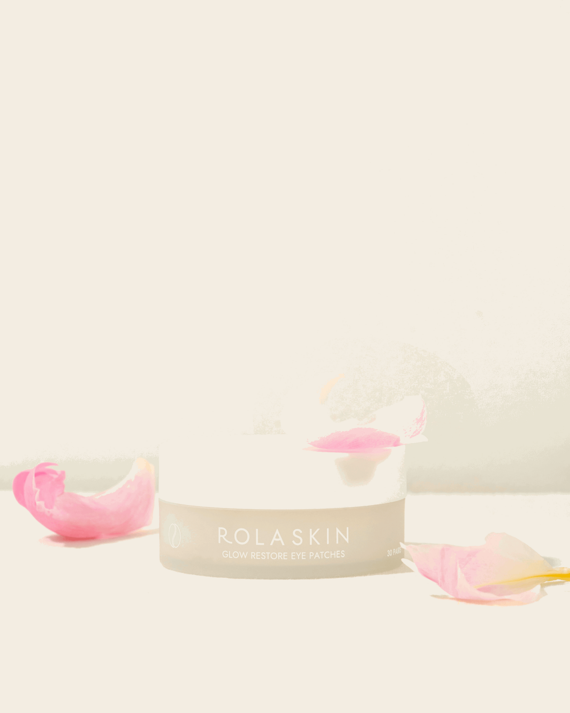 Rolaskin skincare product with pink applicator on a light background