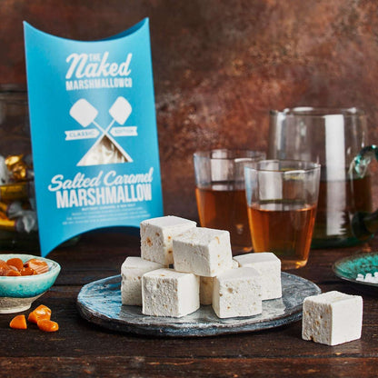 Salted Caramel Marshmallows with packaging and drinks on a wooden table