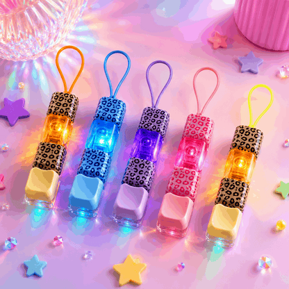 Set of colorful LED keychains with leopard print accents on a pastel background.