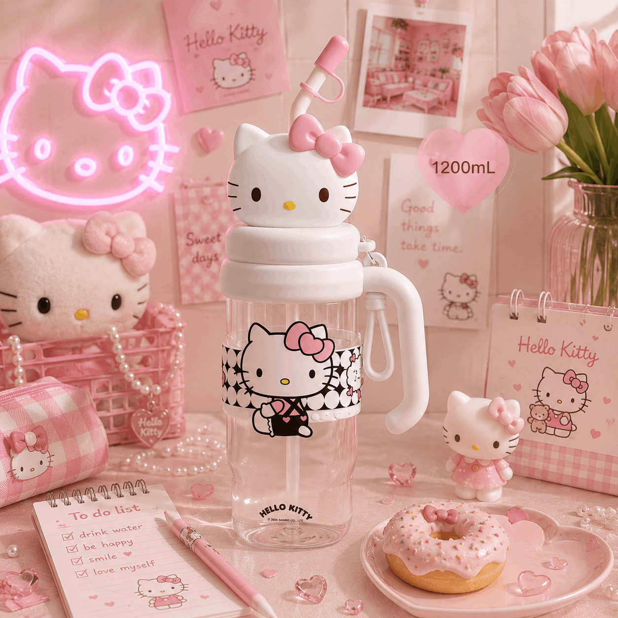 Hello Kitty water bottle on a pink-themed desk with decor items.