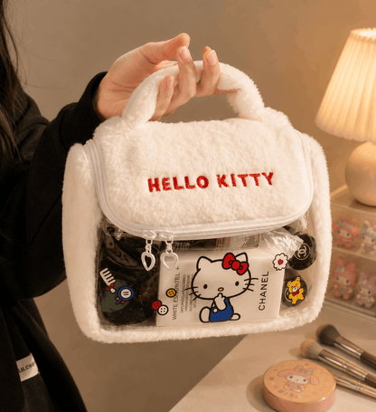White fluffy makeup bag with 'Hello Kitty' branding held by a person, with cosmetic items around.