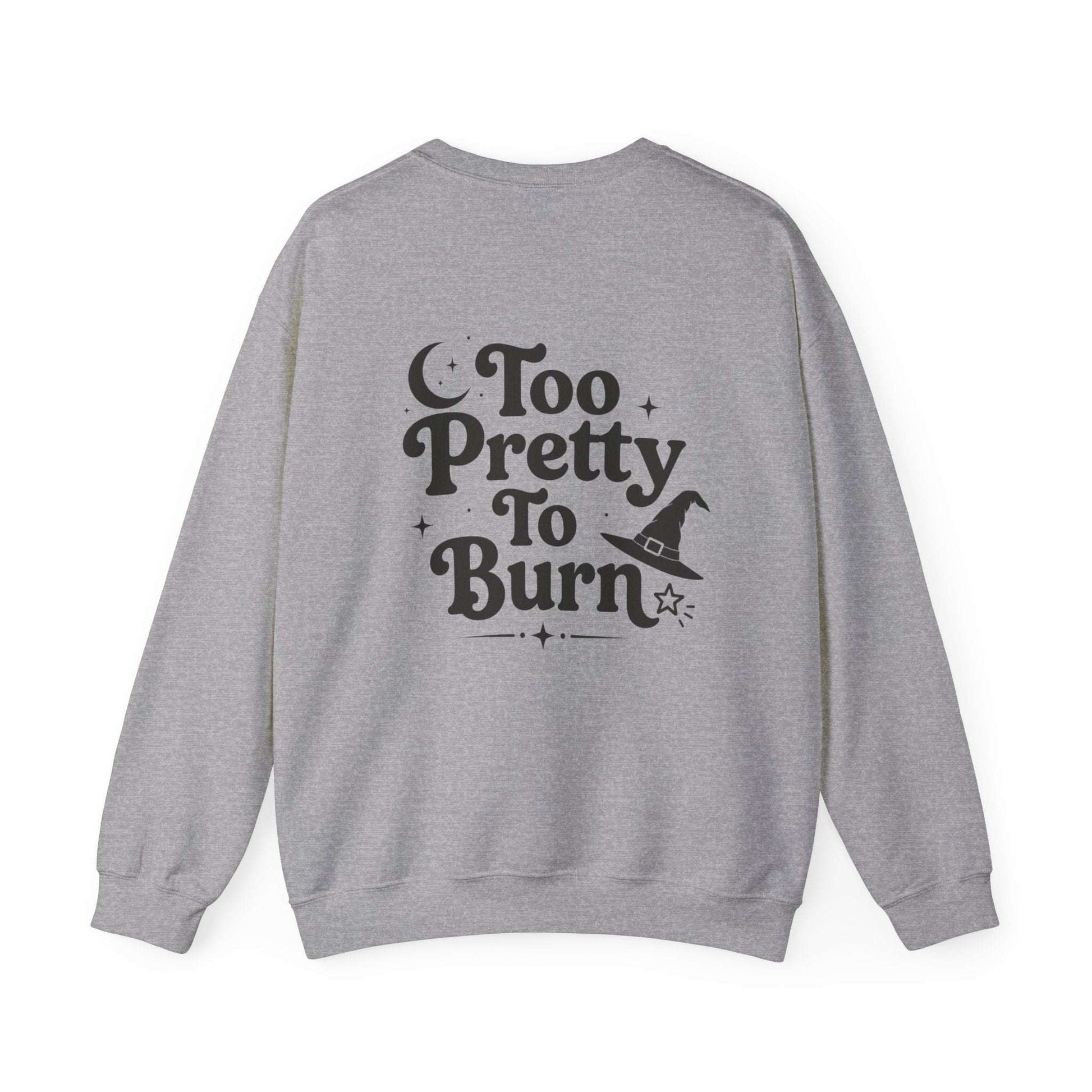 A heather gray crewneck sweatshirt shown from the back, featuring a black graphic print that reads 'Too Pretty To Burn' with a witch hat and stars.