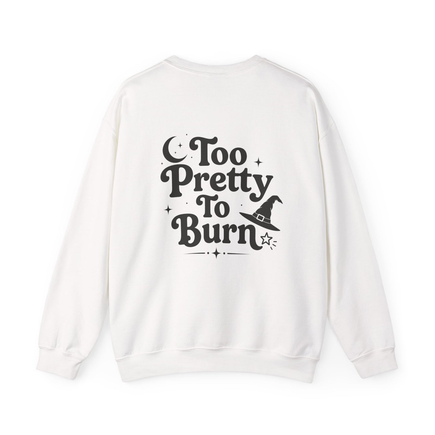 An off-white crewneck sweatshirt shown from the back, featuring a black graphic print that reads 'Too Pretty To Burn' alongside a small witch hat illustration.