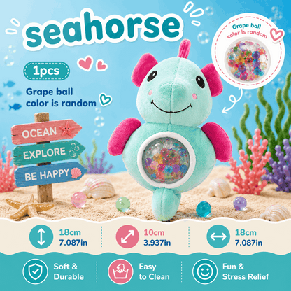 Seahorse-shaped toy with colorful beads inside, on a beach-themed background.