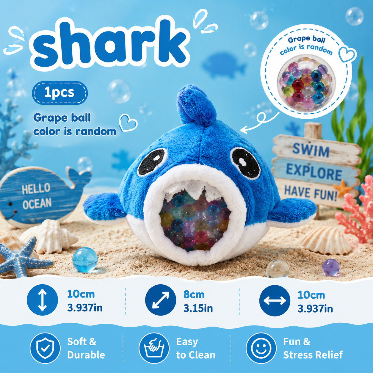 Blue shark plush toy with colorful grape balls on a beach-themed background